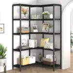 The 01.01.C_结果 black corner shelving unit features five tiers, perfect for OEM and ODM. It holds books, plants, baskets, a radio, clock, vase, and decor in a modern living space with light walls and wood floors.