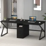 The 01.01.C_结果 is a modern black double desk for OEM/ODM orders, shown with two open laptops, center drawers, and décor in a neutral-toned room with shelves, artwork, and a plant.