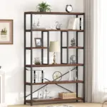 The 02.01.C_结果 is a tall bookshelf with a black metal frame and wooden shelves, perfect for OEM/ODM needs, elegantly styled with books, a lamp, ornaments, a clock, and sculptures against a white wall.