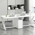 The 03.01.C - 副本_结果 is a modern white double-sided desk for OEM/ODM offices, shown with two laptops, lamp, plant, and notebooks in a bright room with gray cabinets and floor-to-ceiling windows.