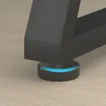 The 07.01.C_结果 black metal furniture leg features a round, black adjustable foot with a blue indicator, shown on a light wood floor—perfect for OEM or ODM furniture solutions.