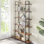 The 09.01.C_结果, a tall bookshelf with five wooden shelves, stands by a large window against a light wall, displaying books, decor pieces, baskets, and small plants.