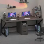 The 10.01.C_结果 features a modern dual-monitor gaming setup on a wooden desk with two desktop towers, OEM keyboards, controllers, and shelves displaying figurines and tech accessories.