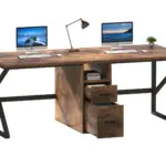 The 14.01.C2_结果 is a wooden double-sided desk featuring two computers, a lamp, a small plant, and an open center drawer—perfect for stylish and functional ODM or OEM office setups.