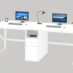 The 14.01.C_结果 is a modern white double desk for ODM and OEM, featuring two computers, a lamp, a plant, framed photo, central drawer unit, all set against a gray background.