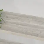 The 2_结果 is a light gray wooden shelf with visible wood grain, ideal for OEM or ODM projects, with a green plant partially visible in the upper left corner.