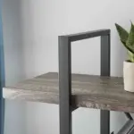 Close-up of the BC02-03 04 - 03 4-Shelf Industrial Rustic Bookcase, featuring a wood and metal frame, placed against a light gray wall with a potted plant on the right—perfect for ODM/OEM customization.